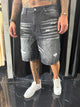 Jeans nero baggy con strappi